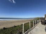 Endless sand and endless ocean in both directions